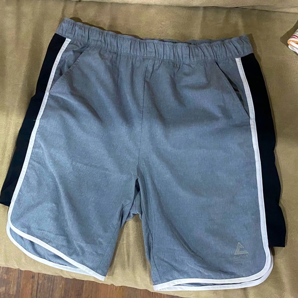 Class technician grey shorts with black lining on sides. Size 95cm Large